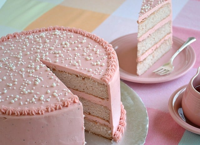 strawberry cake with a slice cut out