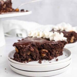 slice of Italian chocolate torte on a stack of white plates