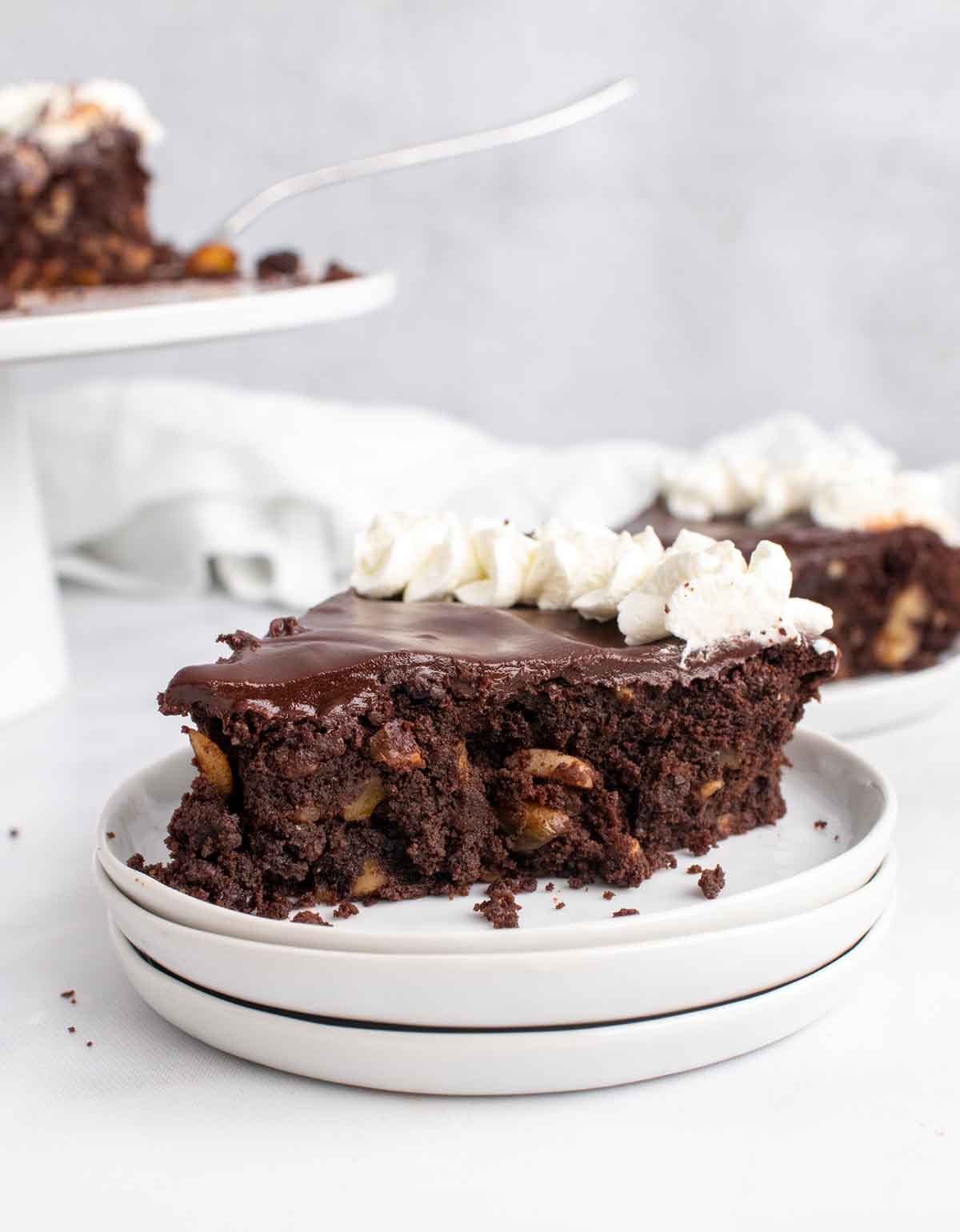 slice of Italian chocolate torte on a stack of white plates