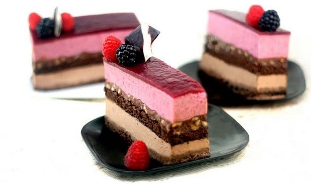 slices of entremet on small black dishes