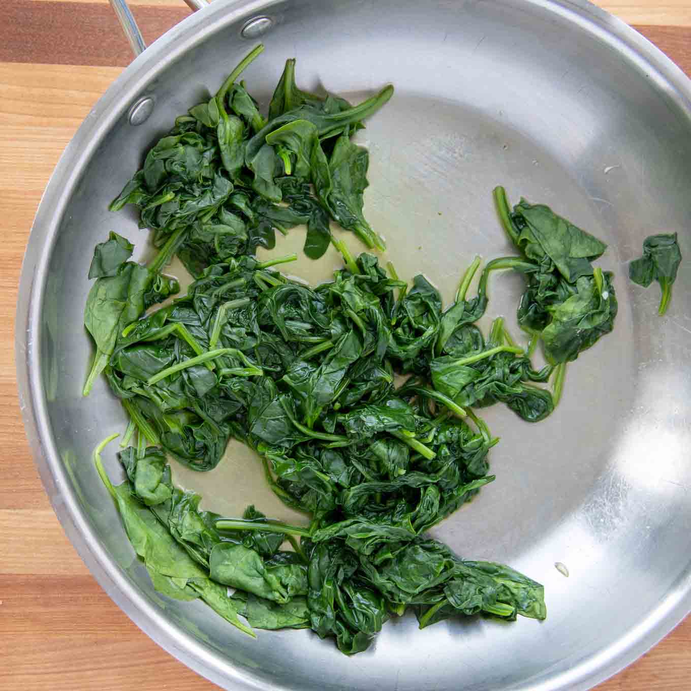 sauteed spinach in pan.