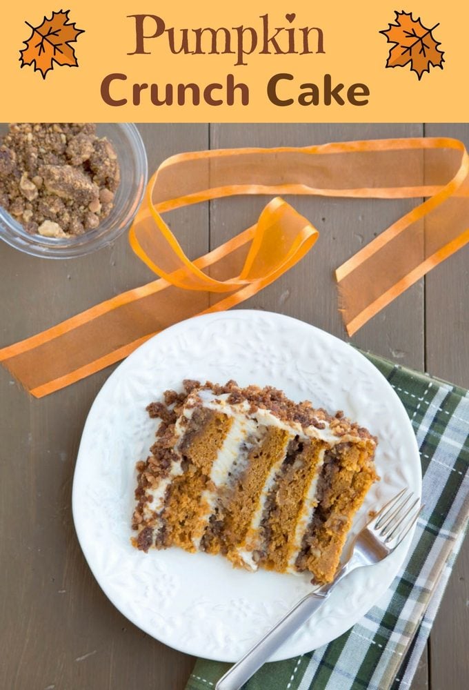 slice of pumpkin crunch cake on a white with a fork and a green plaid napkin 