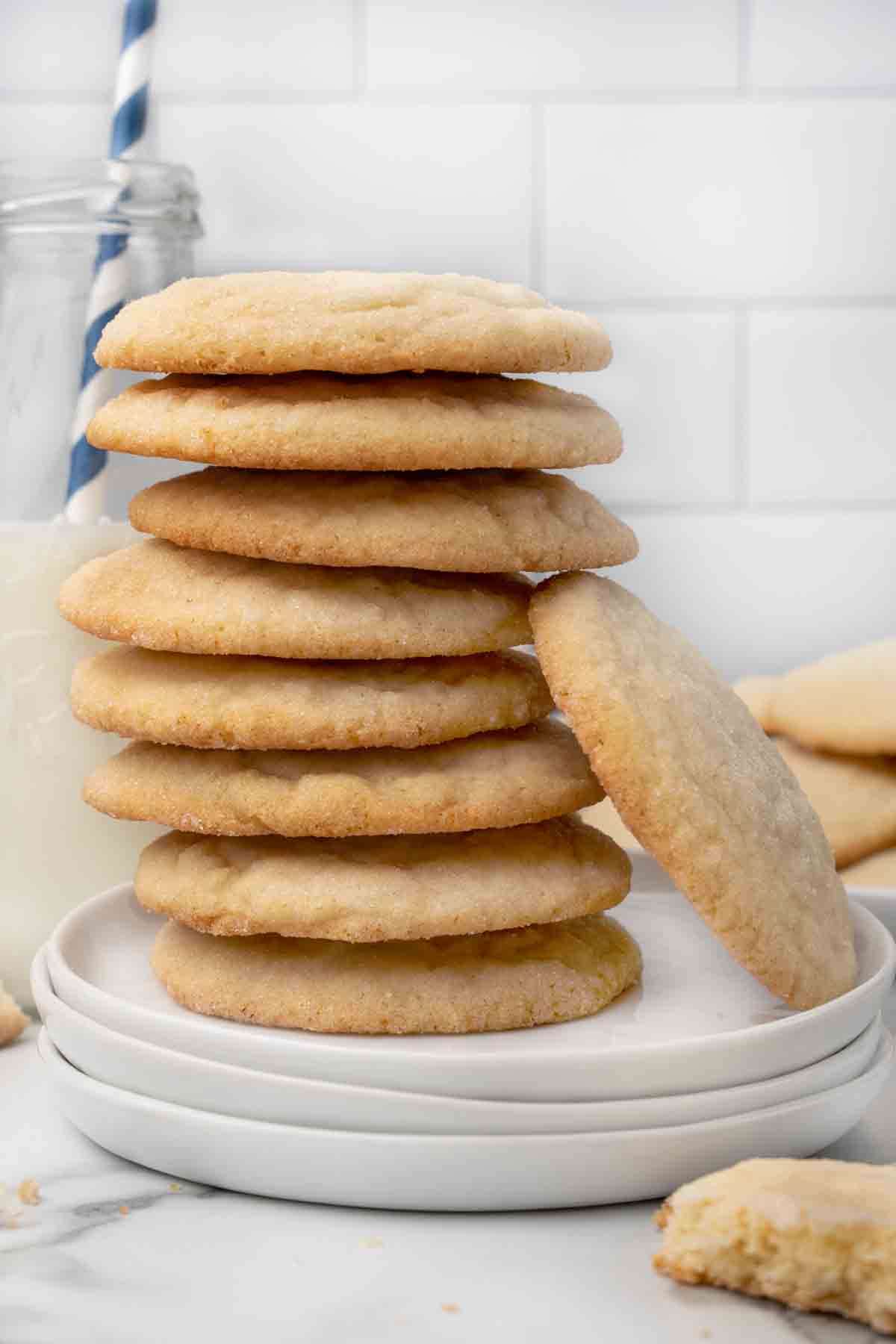 stack of sugar cookies on a white plate