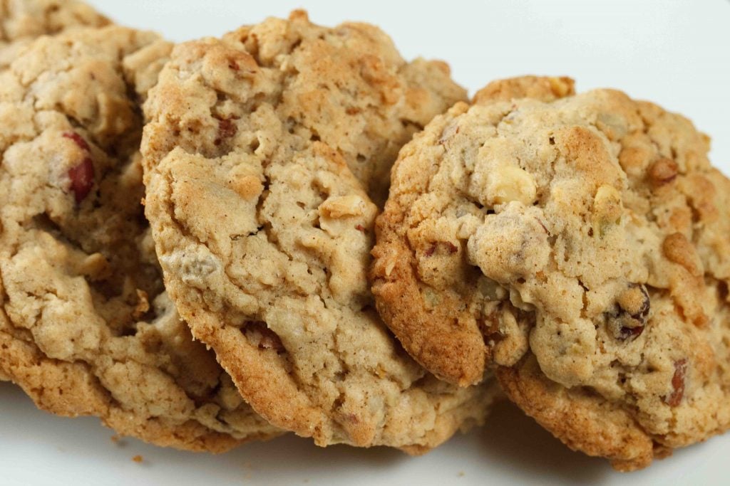 close up of oatmeal granola cookies on a white plate