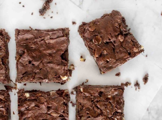 brownies cut and placed on parchment 