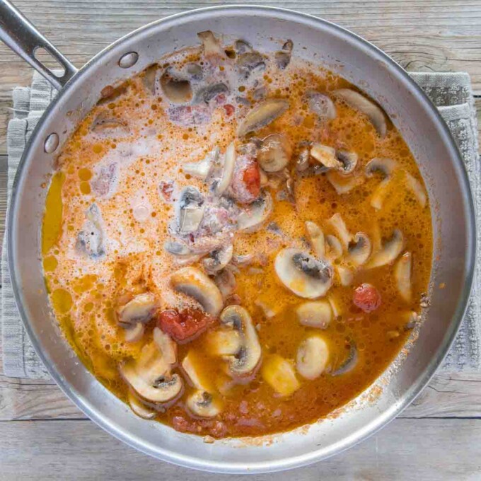 stock, cream and seasonings added to the tomato mushroom mixture