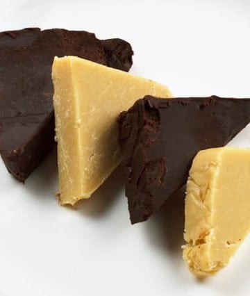 slices of dark chocolate and white chocolate pate on a white plate