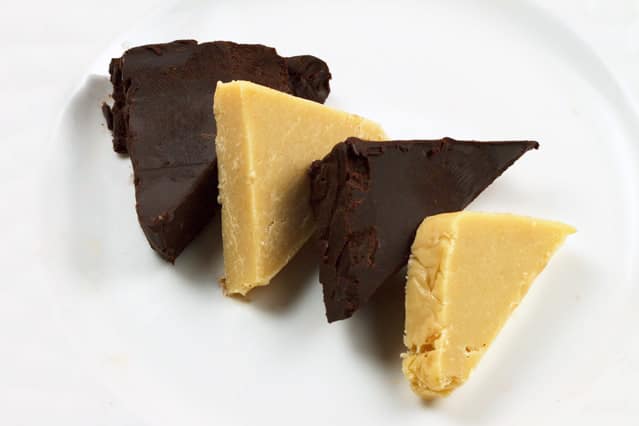 slices of dark chocolate and white chocolate pate on a white plate