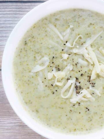 Broccoli Cheddar Soup in white bowl.