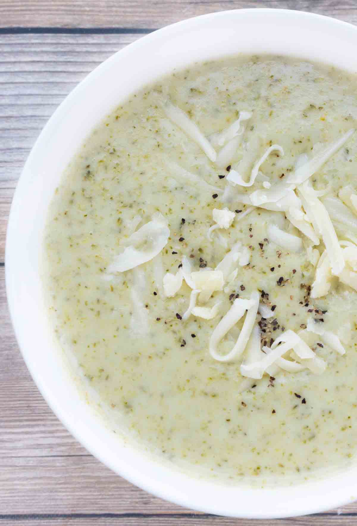 Broccoli Cheddar Soup in white bowl.