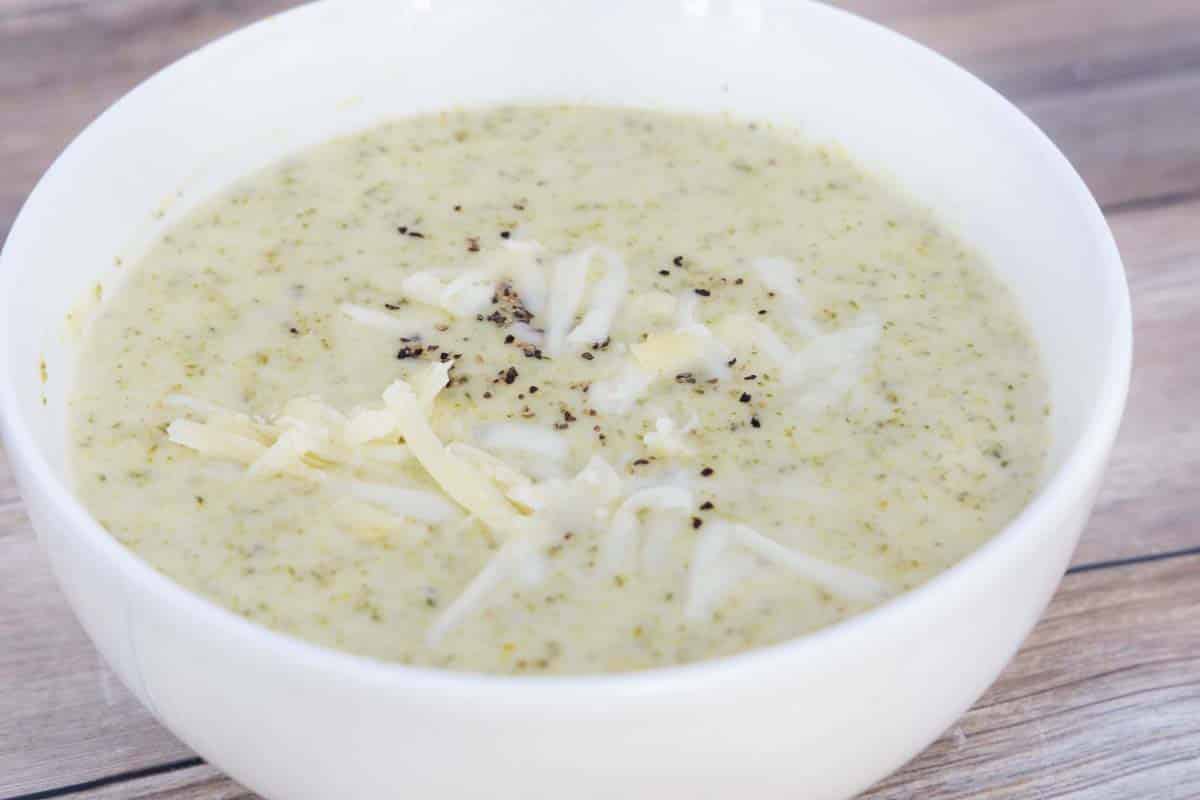 Broccoli Cheddar Soup in white bowl.