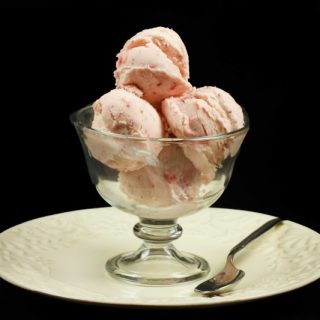a dessert dish with 4 scoops of strawberry ricotta gelato