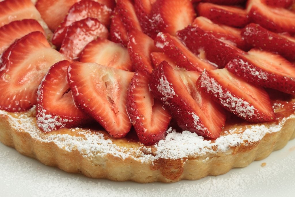 partial view of an Italian strawberry ricotta crostata 