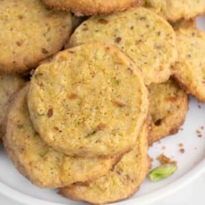cornmeal pistachio butter cookies on a white plate
