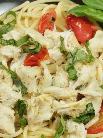 pasta topped with jumbo lump crabmeat, basil and tomatoes