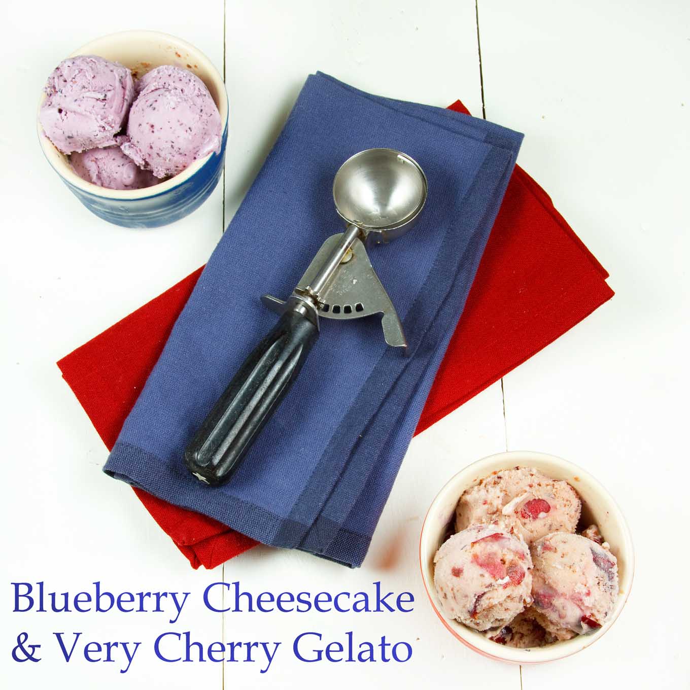 overhead shot of ramekins of Blueberry Cheesecake gelato and Very Cherry Gelato with a red and a blue napkin in between with an ice cream scoop on top