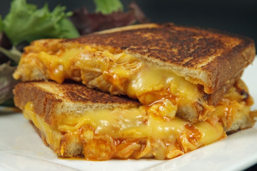 buffalo grilled cheese sandwich cut in half and stacked