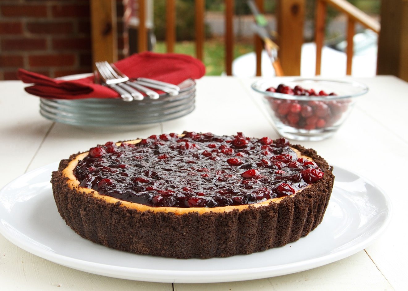 whole amethyst cheesecake on a white platter