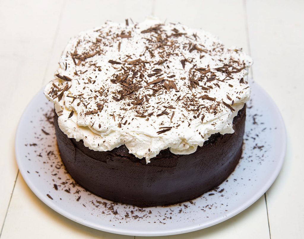 overhead shot of Chocolate Fudge Cake with Whipped Cream