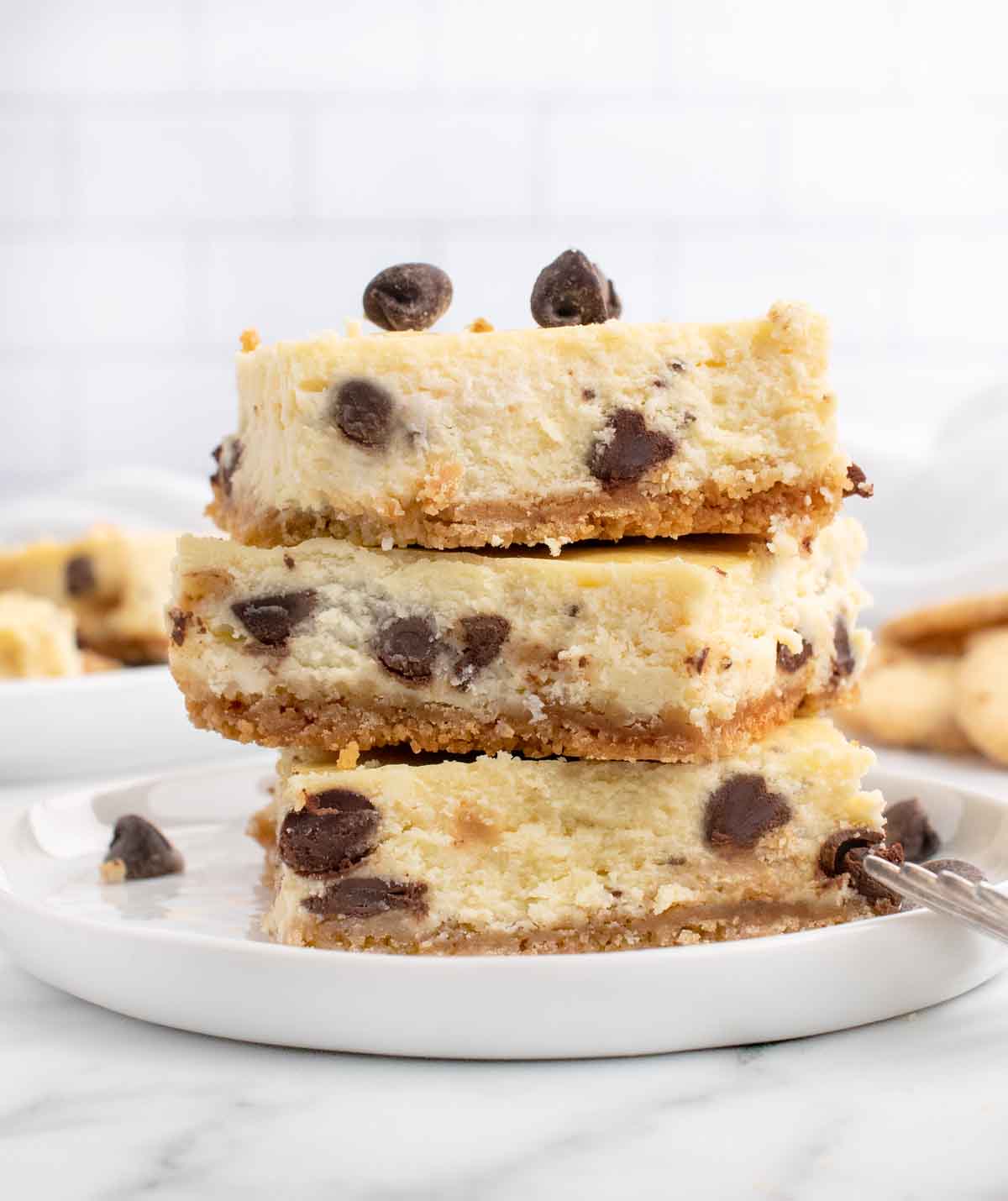 stack of chocolate chip cookie bars on a white plate