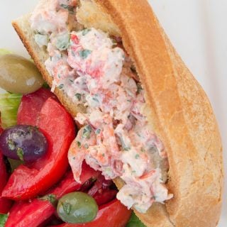 overhead view of a lobster roll and tomato salad