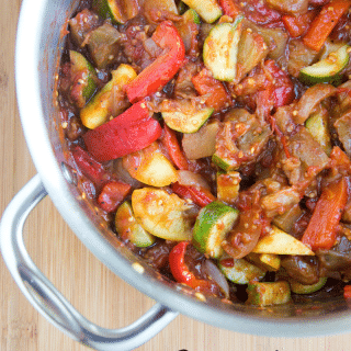 overhead partial view of a pot with cooked ratatouille