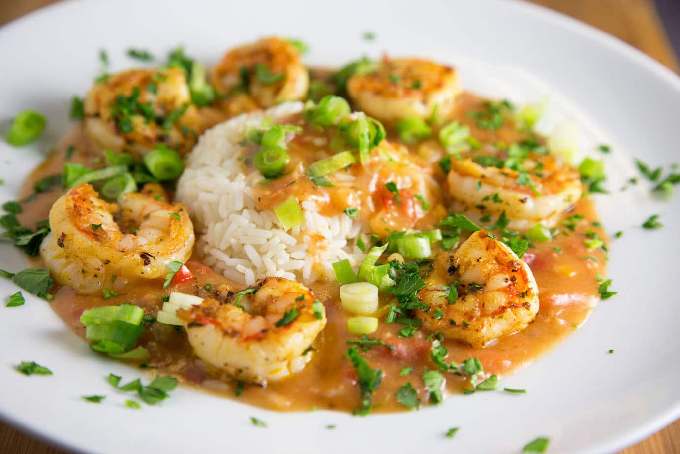 Shrimp Étouffée with rice on a white plate