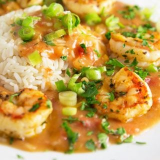 Shrimp etouffee on a white plate with rice