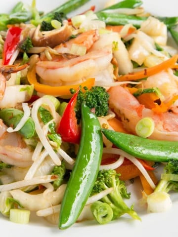 shrimp stirfry in a white bowl