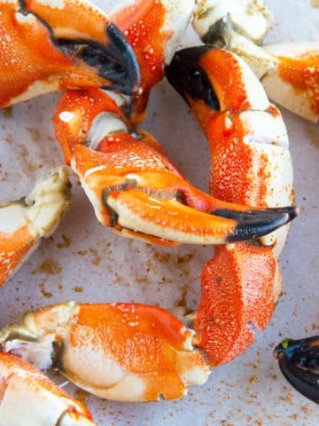 cooked jonah crab claws on white plate