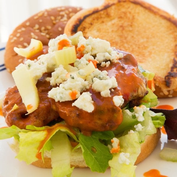 Buffalo veggie burger on a lettuce topped with bleu cheese