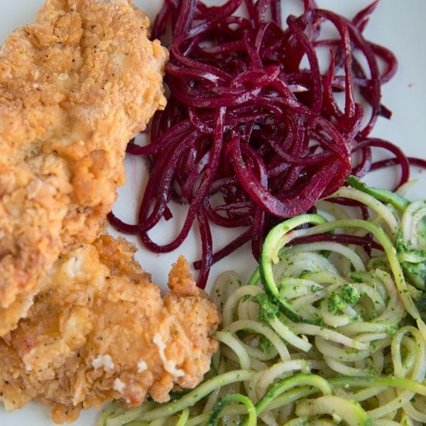 Buttermilk fried chicken tenders with sauteed Zucchini noodles and beet noodles