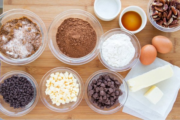 overhead view of ingredients to make Gluten Free Cocoa Brownies on a wooden cutting board