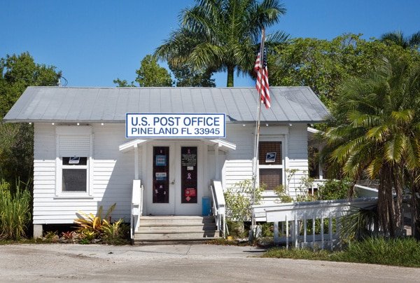 very small Pine Island post office with an American flag out front