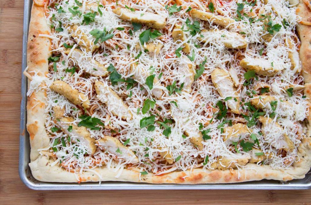 Sheet pan chicken parm pizza ready to bake