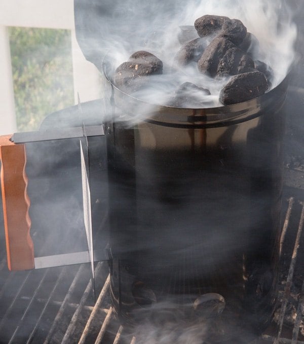 grill chimney full of charcoal smoking