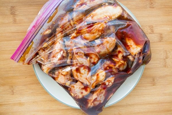 ziplock bag of chicken wings marinating