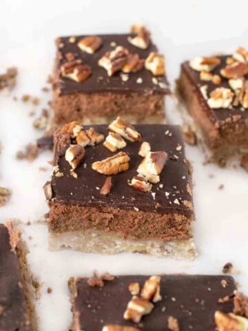 slices of chocolate cheesecake bars on a white counter