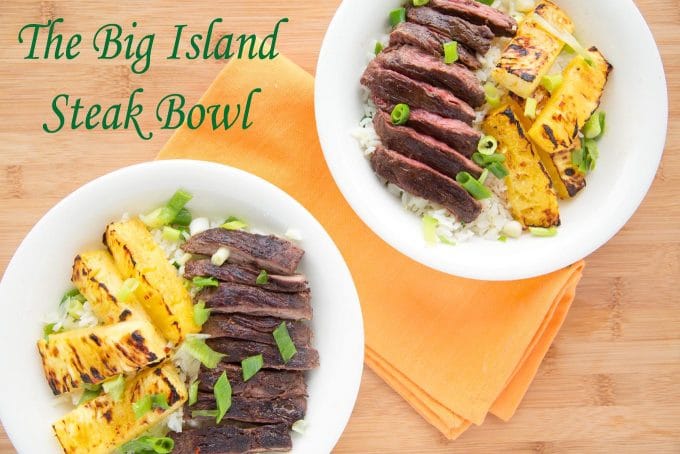 2 servings of grilled pineapple and grilled flank steak over rice in a white bowls