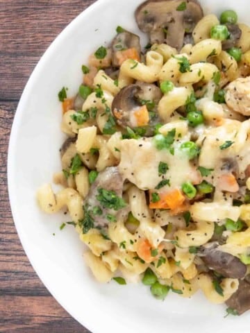 Chicken and mushroom pasta bake in a white bowl