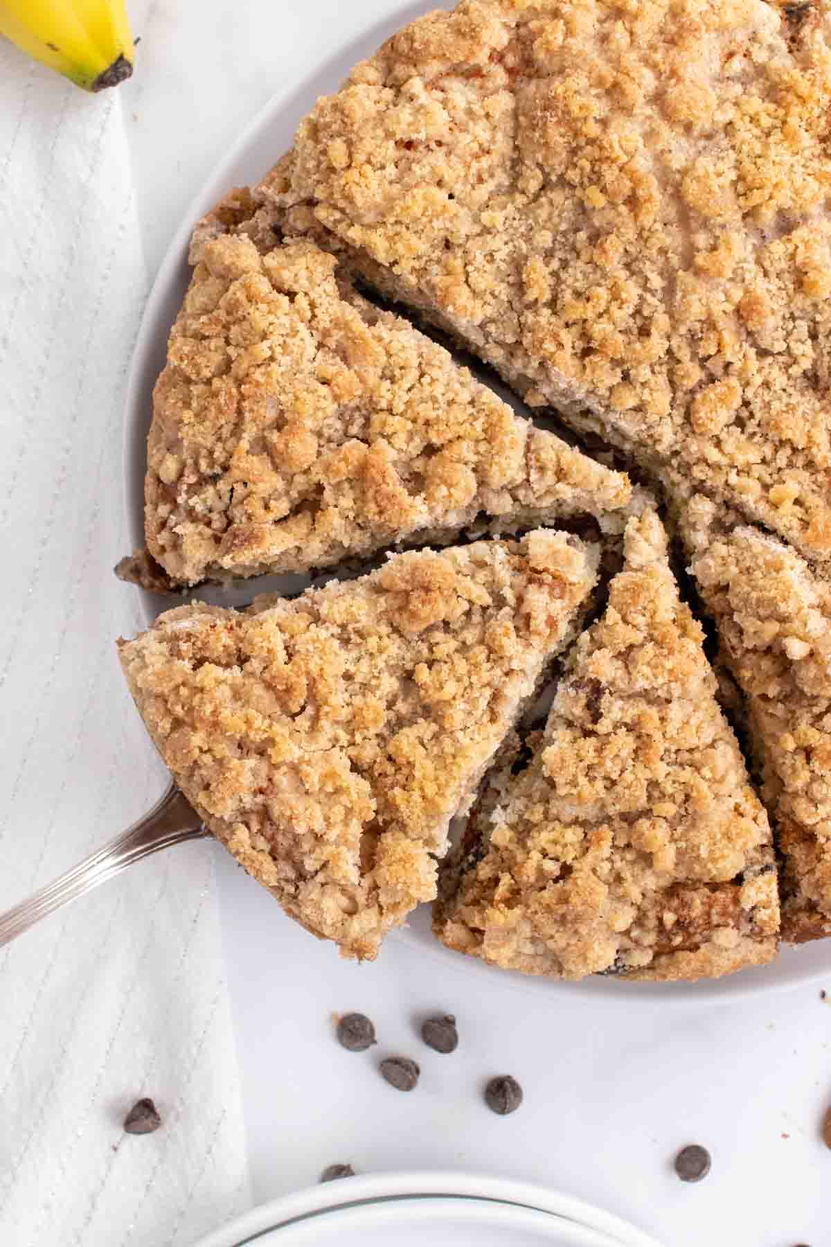 overhead partial of view of sliced banana crumb cake