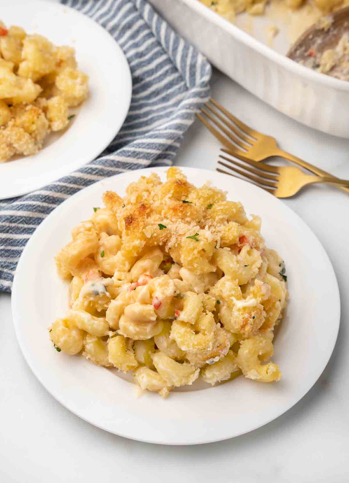 mound of truffled mac and cheese on white plate 