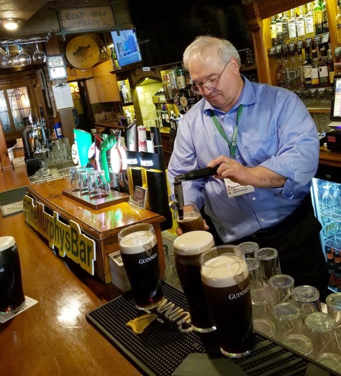 Chef Dennis pouring a pint of Gunniess at Murphy's Bar in Killarney Ireland