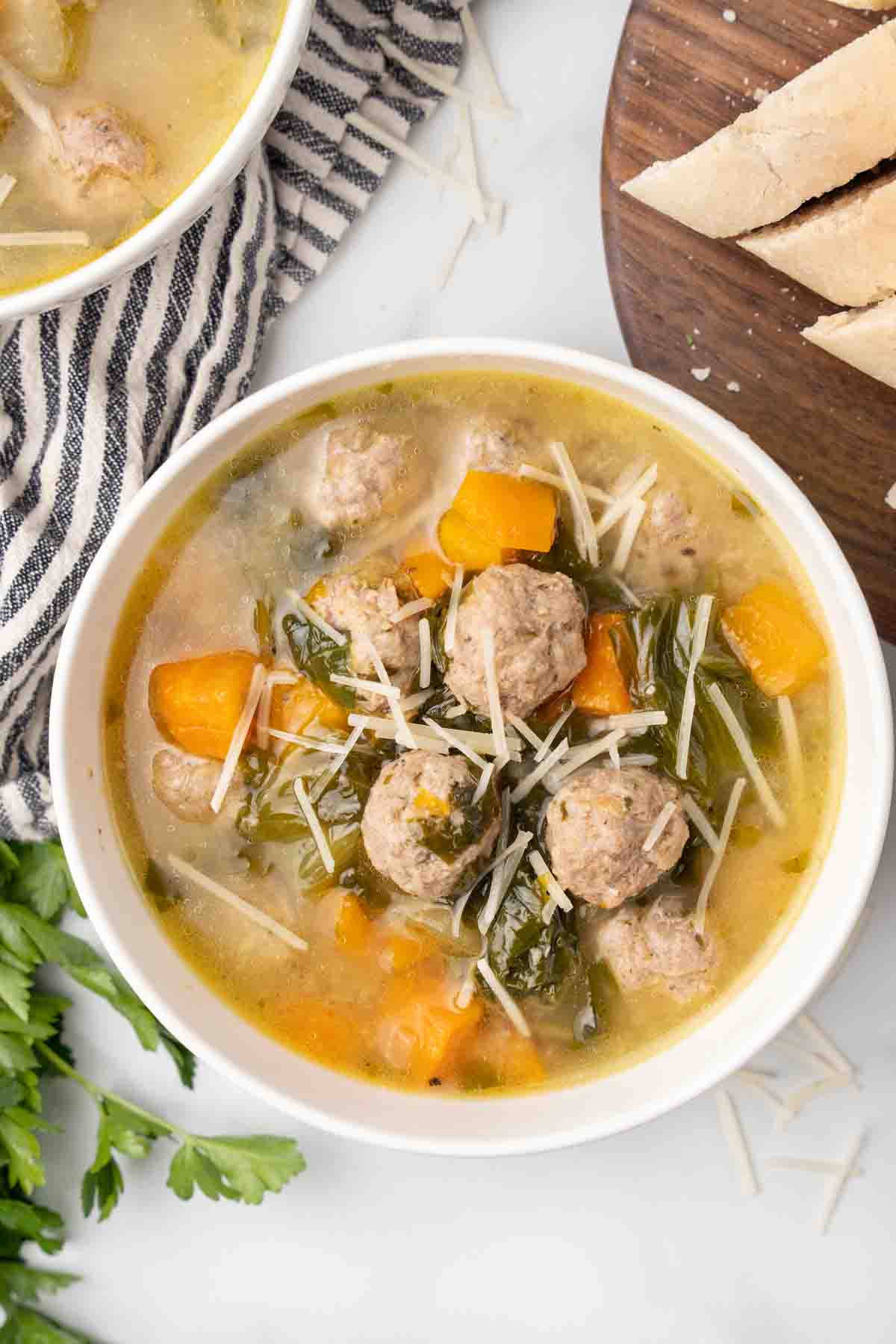 italian wedding soup in a white bowl