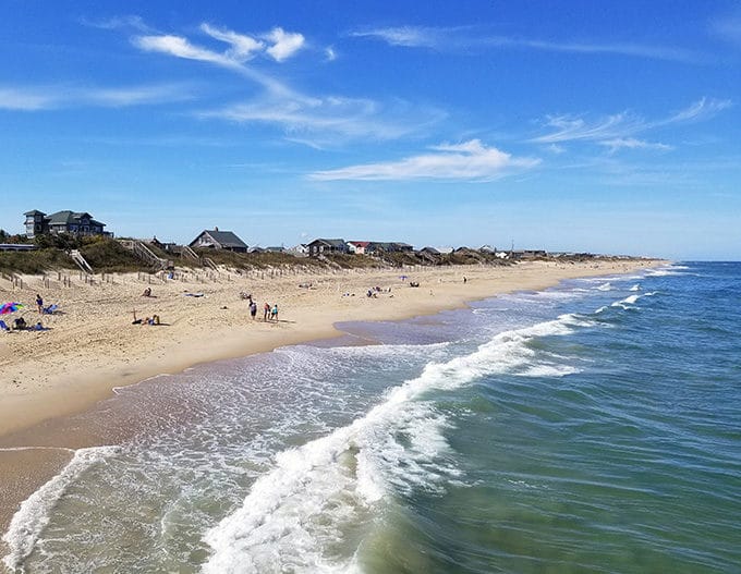 view of the beach and ocean with a blue sky in the Outer Banks of North Carolina