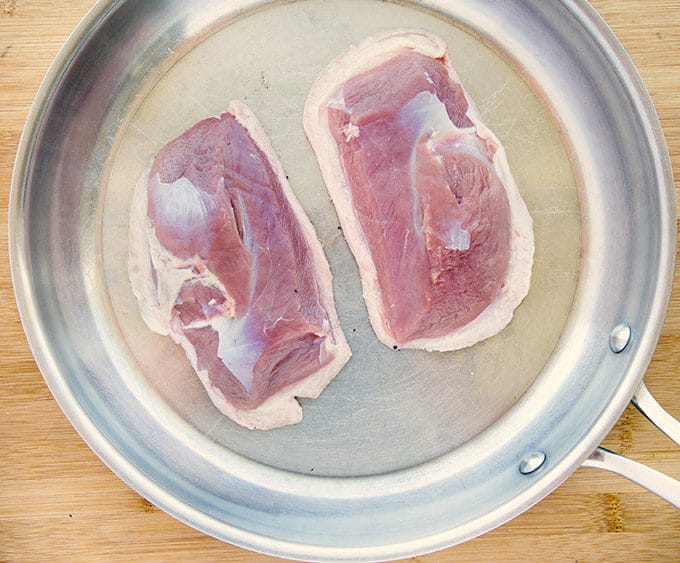 2 duck breast skin side down in a cold stainless steel saute pan