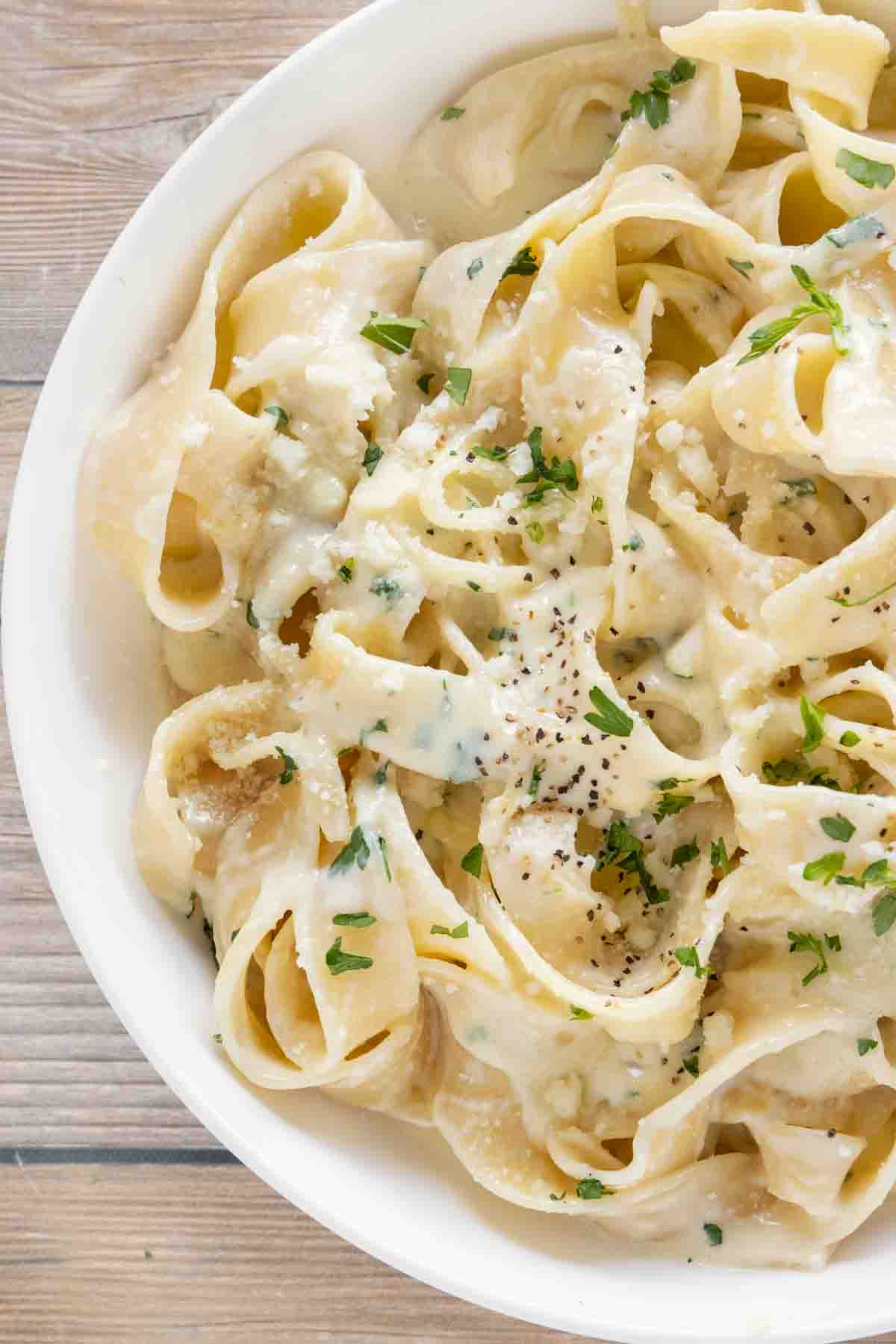 Fettuccine Alfredo in a white bowl.