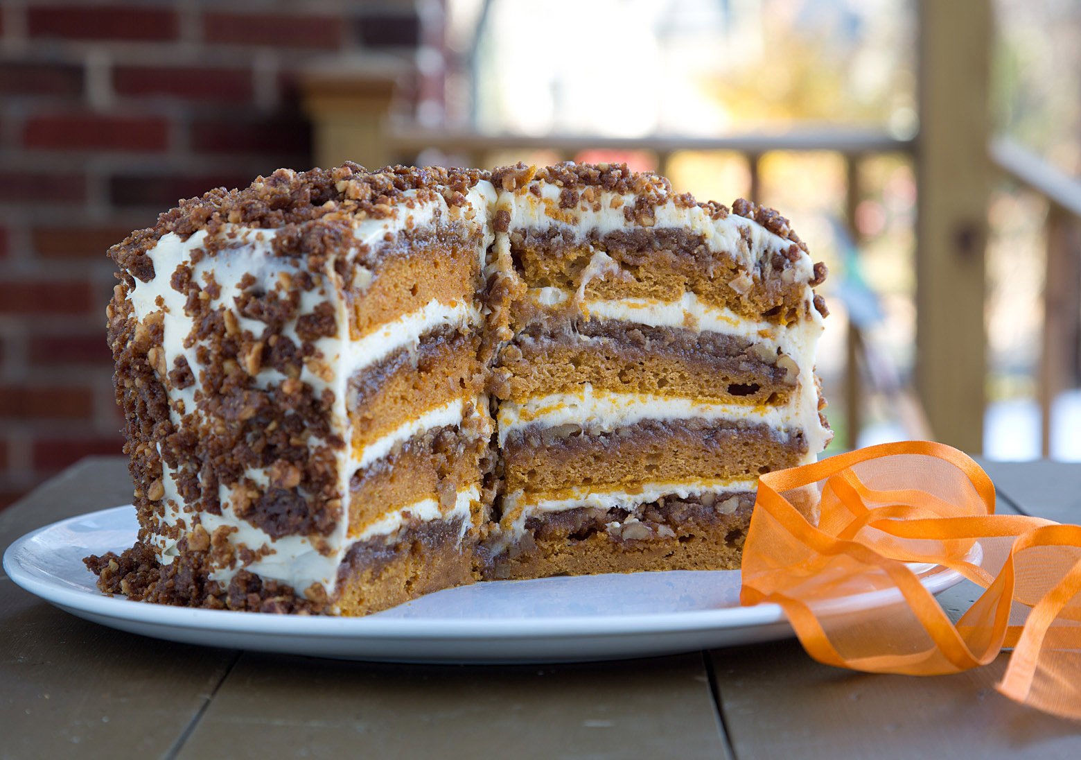 pumpkin crunch with slices taken out on a white platter