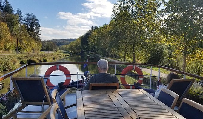 sitting on the deck of la Belle Epoque on a canal cruise in Norhern Burgundy