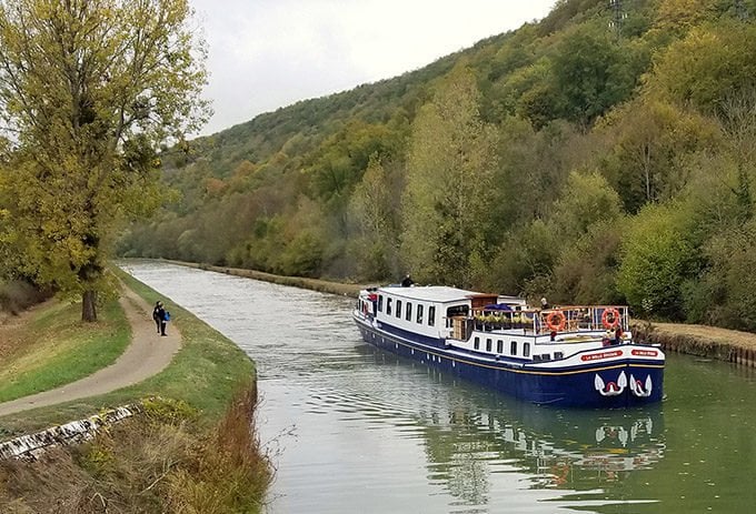 European Waterways barge cruising on a canal in Northern Burgundy France